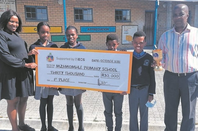 school kids receiving cheque